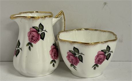 Two piece find bone China, teacup and cream pitcher