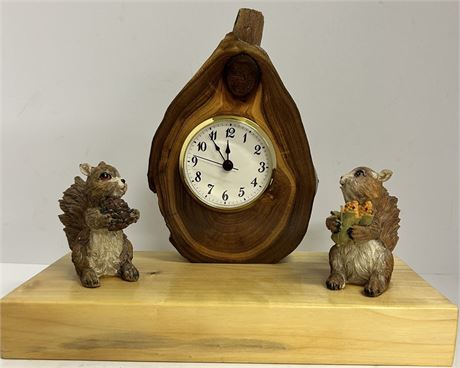 Cute little clock with some squirrels next to it